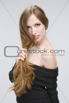 Girl holding her hair