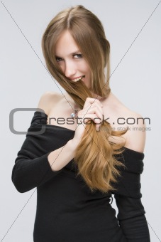 Girl biting her hair