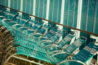 Several Cruise Ship Lounge Chairs Abstract Image.