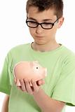 Boy holding a piggy bank money box