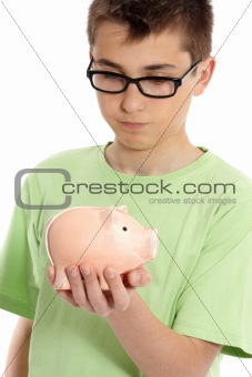 Boy holding a piggy bank money box