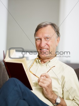 senior man reading book