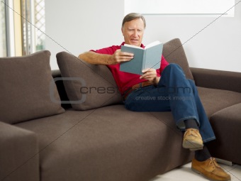 senior man reading book