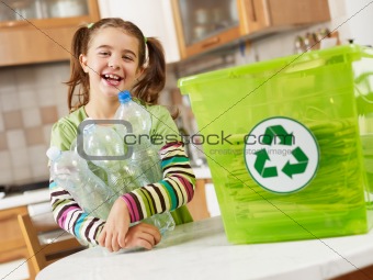 girl recycling plastic bottles