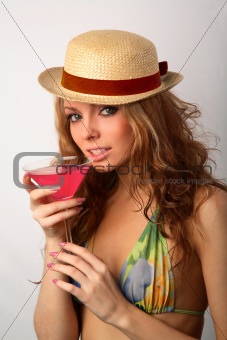 girl in a bikini with a cocktail
