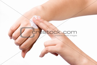 Applying cream to hands