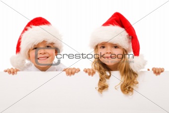 Happy christmas kids with white sign - isolated