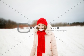Young woman in red hat and scarf