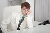 Young businessman misses on workplace at office