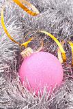 Christmas balls among silver glittering decoration