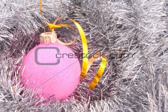Christmas balls among silver glittering decoration