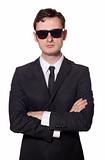 bodyguard with glasses and folded arms