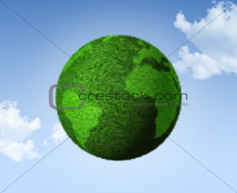 3D green grass globe on a blue sky