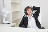 Woman listens to music in ear-phones