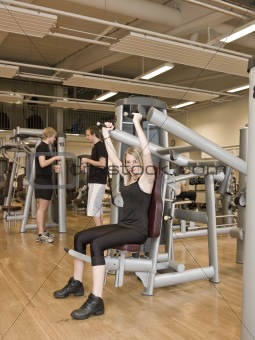 Girl using an exercise machine 