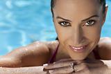 Face of a Beautiful Smiling Woman Relaxing In Swimming Pool