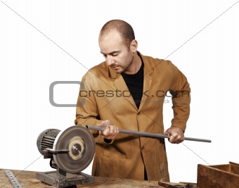 craftsman work at grinder