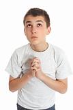 Boy in prayer looks to heaven for answers
