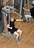 Young man using an exercise machine
