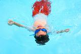 Boy Floating in Pool