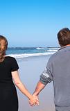 Couple walking on the sandy beach