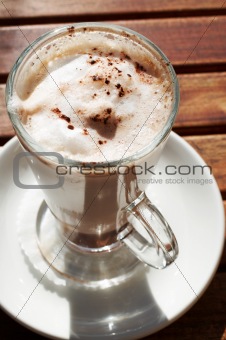 Closeup of cafe latte in long glass cup