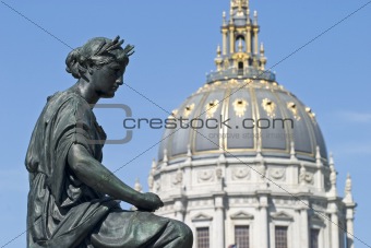  statue with City Hall dome and face