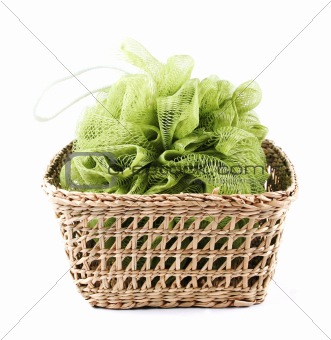 Green bath loofah in a basket