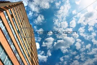 new apartments building and cloudy sky as a background