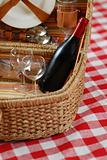 Picnic basket with wine and glasses