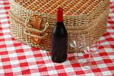 Picnic basket with wine and glasses