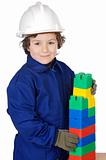 adorable future builder constructing a brick wall with toy piece