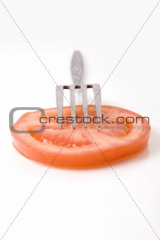 tomato slice on the fork