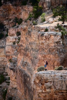 Man standing near the edge of the Grand Canyon