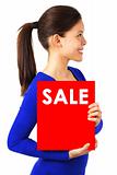 Woman with sale sign