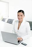 Modern businesswoman working in white office