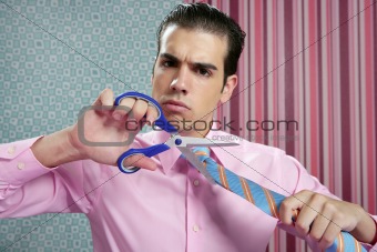 Businessman stressed with scissors cutting his tie