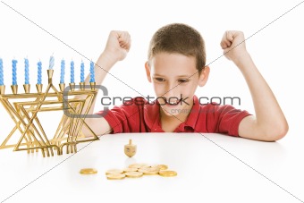 Boy Spinning the Chanukah Dreidel