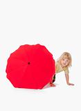 boy with long blond hair plaing with a red umbrella