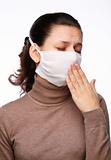 Coughing woman in a medical mask on a white background