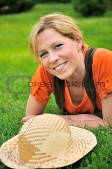 Young woman laying on the grass