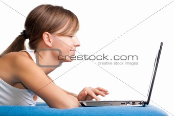 Young girl chatting using her laptop