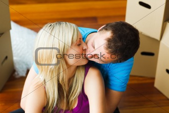 Couple moving to new house and kissing 