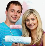 Couple using two colours to paint their new house