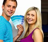 Couple with colour samples to paint new house