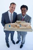 Architects holding a model house