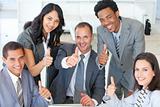 Business team with thumbs up in office