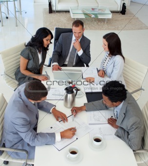 High angle of businessteam working in a meeting