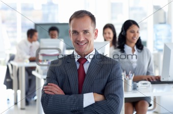 Smiling manager leading his team in a call center