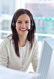 Portrait of a smiling businesswoman working in a call center